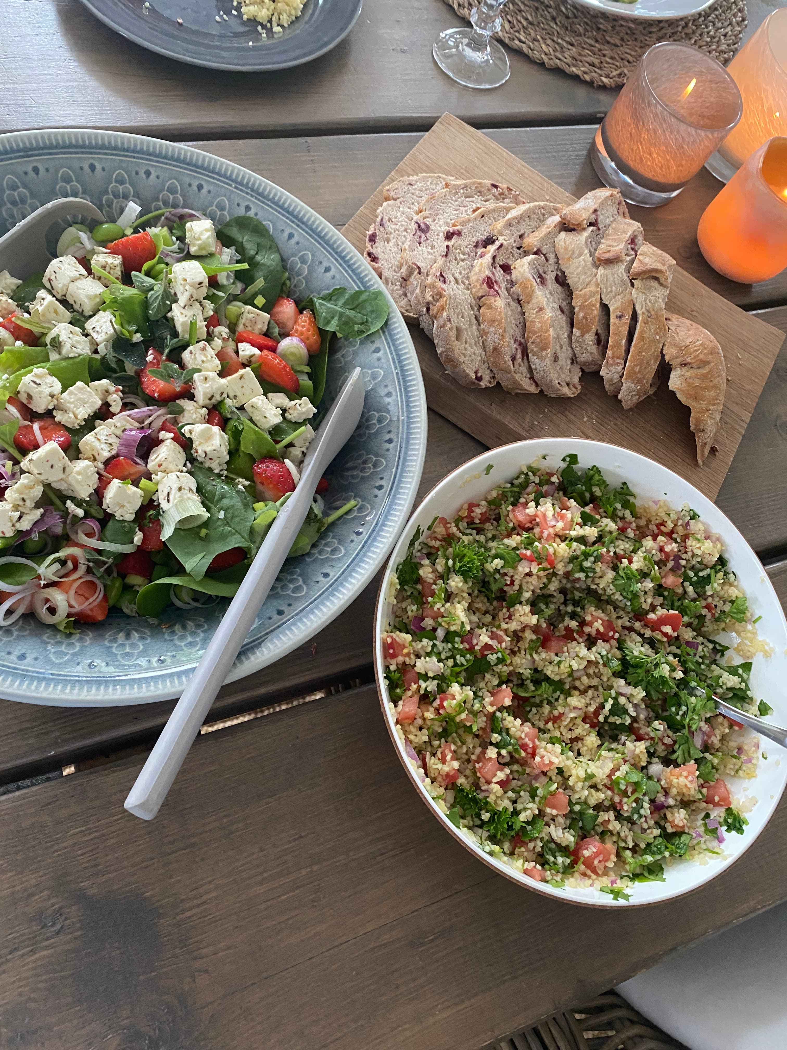 A spread of tabbouleh and strawberry-feta salad Ellen cooked, on the table