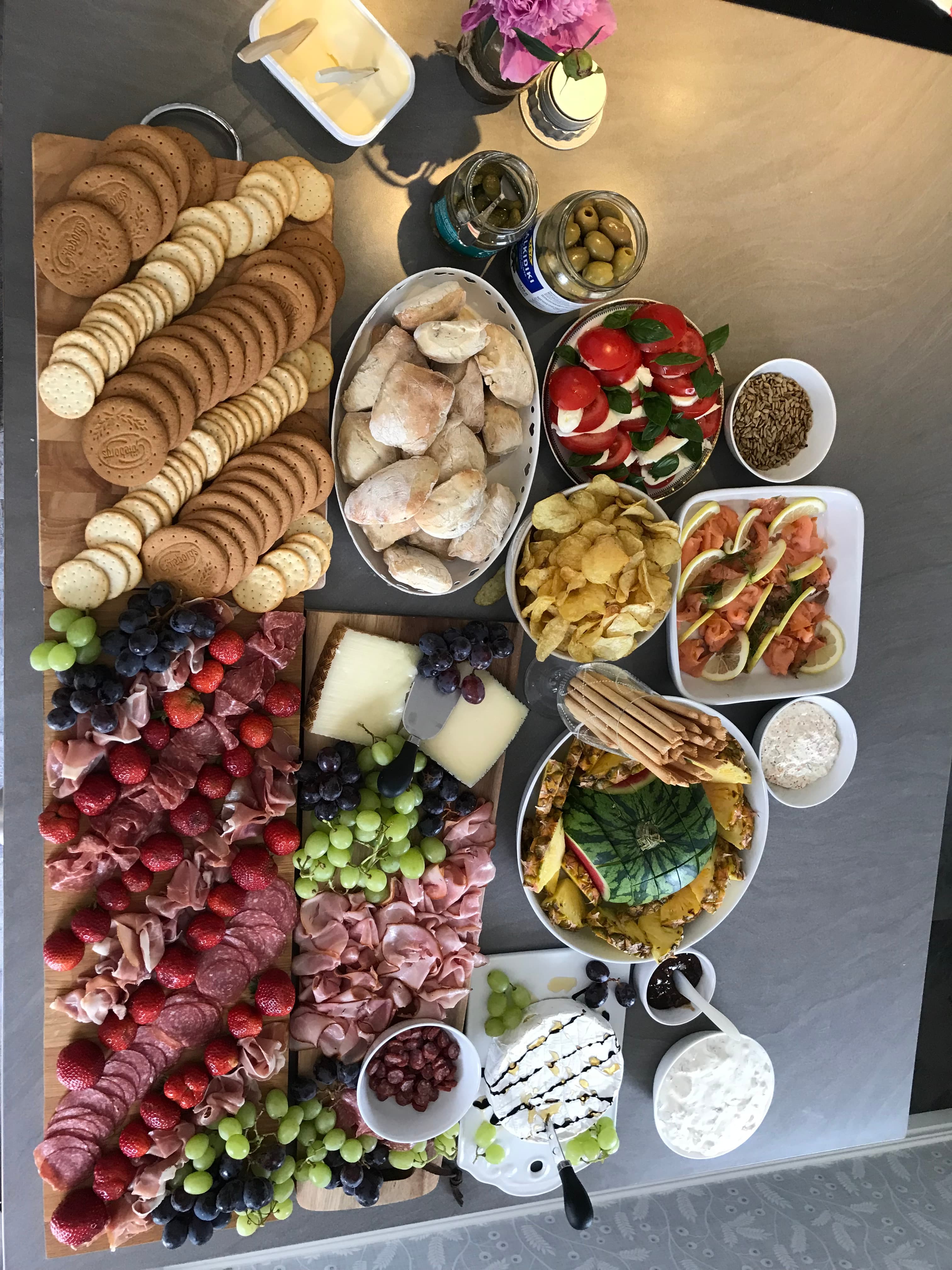 A generous grazing board of cheeses, charcuterie, fruit and smoked salmon Ellen laid out for an event